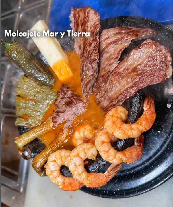 Mariscos platters over the open grill